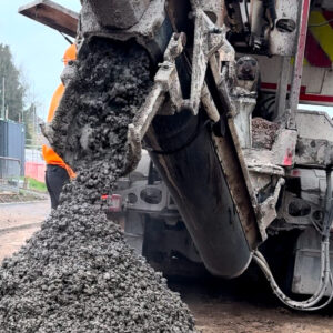 Concrete being delivered to a house.